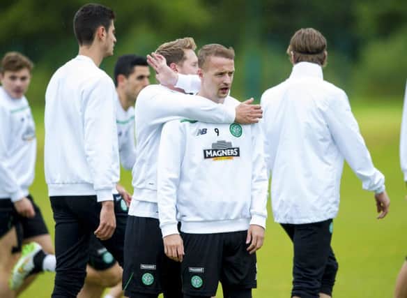 Kris Commons gets to grips with Celtic team-mate Leigh Griffiths. Picture: SNS