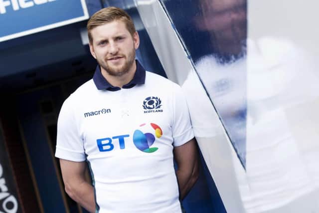 Finn Russell wears Scotland's new look for the 2015-16 season. Picture: SNS