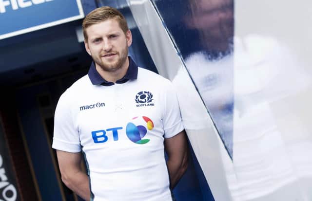 Finn Russell wears Scotland's new look for the 2015-16 season. Picture: SNS
