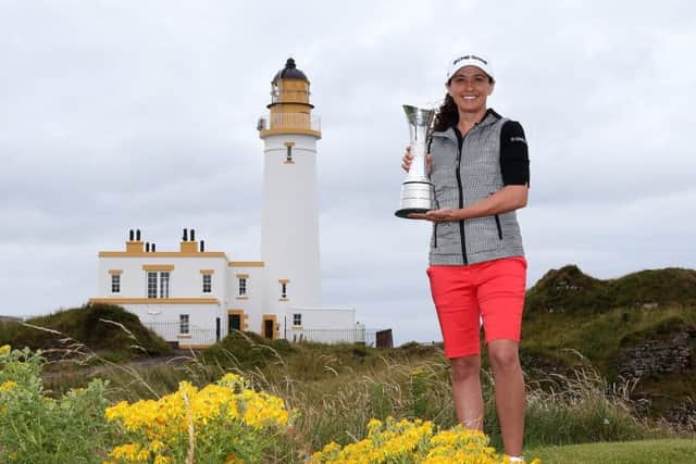 Reigning champion Mo Martin poses with the trophy ahead of this week's Ricoh Women's British Open at Turnberry. Picture: Getty