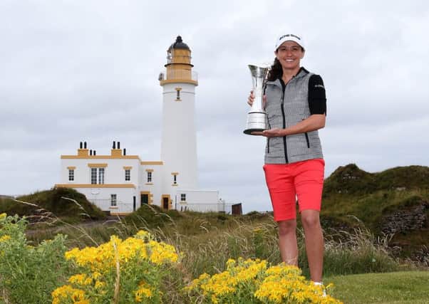 Reigning champion Mo Martin poses with the trophy ahead of this week's Ricoh Women's British Open at Turnberry. Picture: Getty
