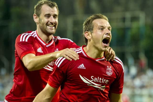 Peter Pawlett celebrates after scoring Aberdeen's second goal during the 3-0 away victory against HNK Rijeka. Picture: SNS
