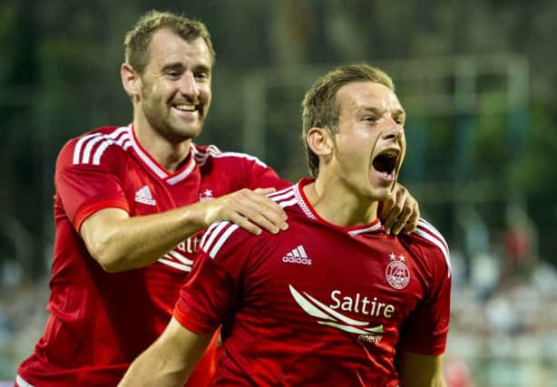 Peter Pawlett celebrates after scoring Aberdeen's second goal during the 3-0 away victory against HNK Rijeka. Picture: SNS