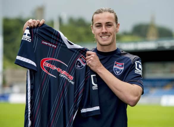 Ross County's Jackson Irvine is all smiles after signing with the Highland club. Picture: SNS