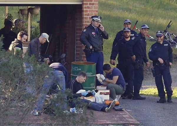 Police search the home of suspect Leonard Warwick near Sydney, Australia. Picture: AP