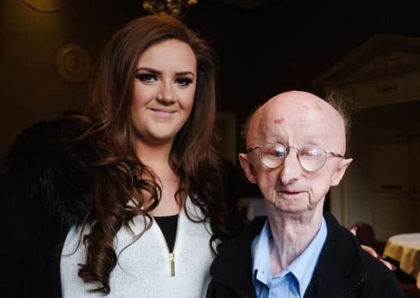 Disabled pensioner Alan Barnes from Gateshead is pictured with beautician Katie Cutler, who started a fundraising campaign on his behalf. Picture: Getty Images