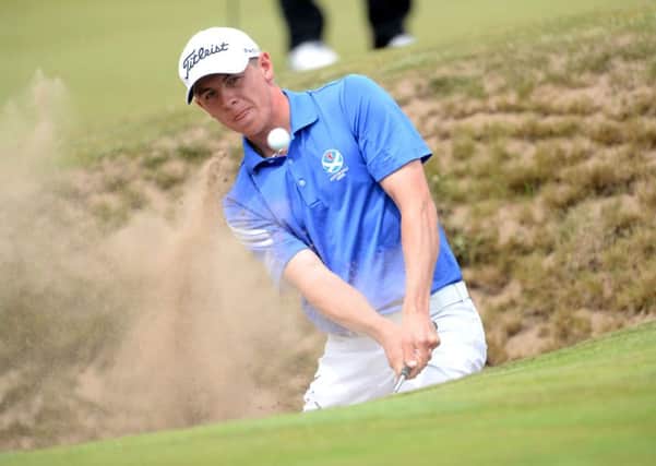 Craigielaw player Grant Forrest plays a bunker shot during the Scottish Amateur Championship at Muirfield yesterday. Picture: SNS