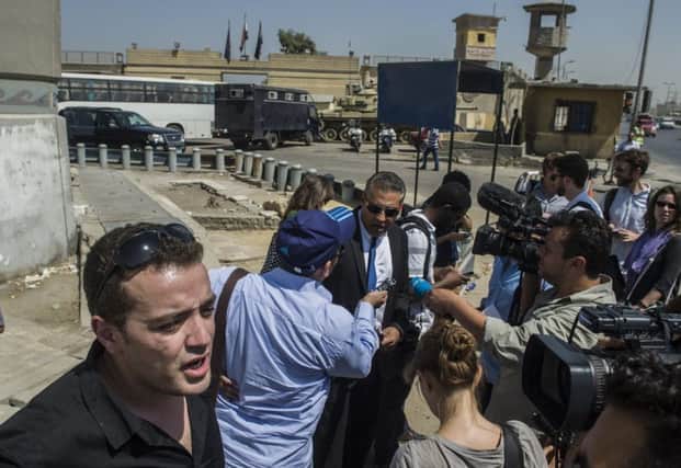 Baher Mohammed and Mohammed Fahmy face the media outside court yesterday. Picture: Getty