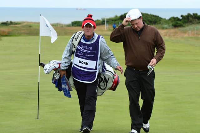 Scotlands Chris Doak walks from the 18th green after beating Anthony Wall at the final hole. Picture: Getty
