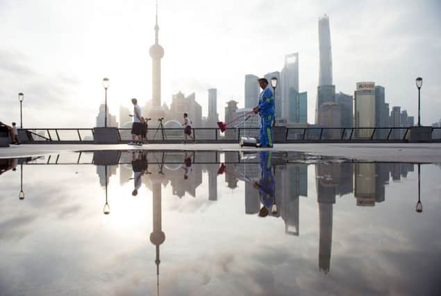 Shanghais financial district has felt the pinch as its stock market plunged 8 per cent on Monday. Picture: Getty