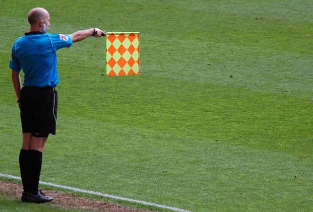 A linesman flags for offside. Picture: Contributed