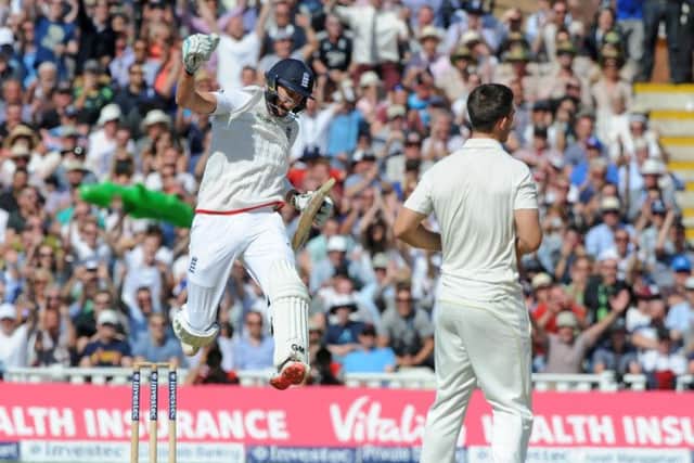 Joe Root, left, celebrates after helping guide England to an eightwicket win on day three of the third Ashes Test. Picture: AP