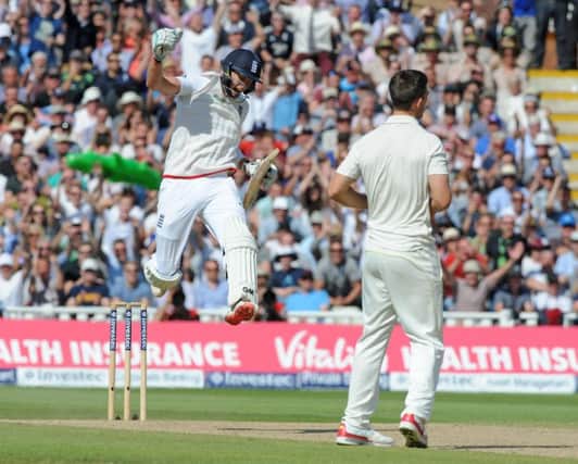 Joe Root, left, celebrates after helping guide England to an eightwicket win on day three of the third Ashes Test. Picture: AP