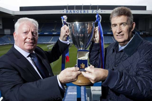 Sandy Jardine presents him with a replica Cup-Winners Cup-winning medal at Ibrox in 2013. Picture: SNS
