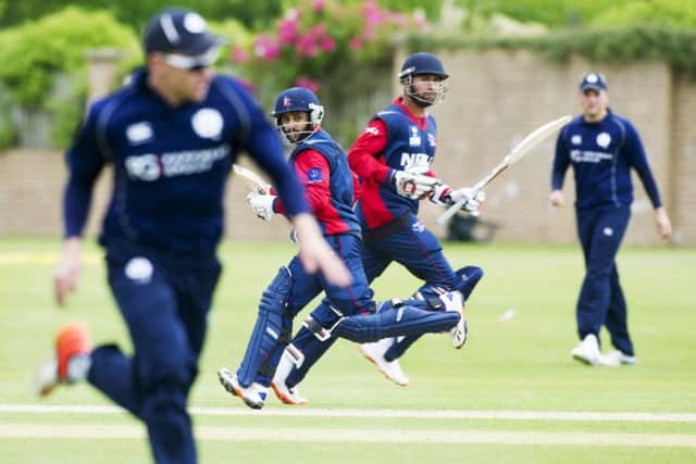 Nepal batsmen Prithu Baskota and Sharad Vesawkar (right) make runs on a day dominated by the bowlers. Picture: Donald MacLeod
