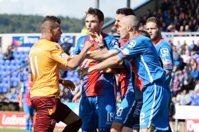 Tempers flare between Inverness players and Motherwell's Marvin Johnson. PIcture: SNS
