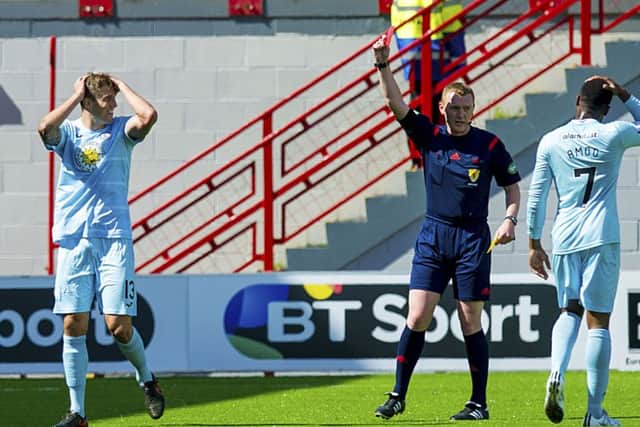 Partick's Frederic Frans is shown the red card for a second bookable offence. Picture: SNS