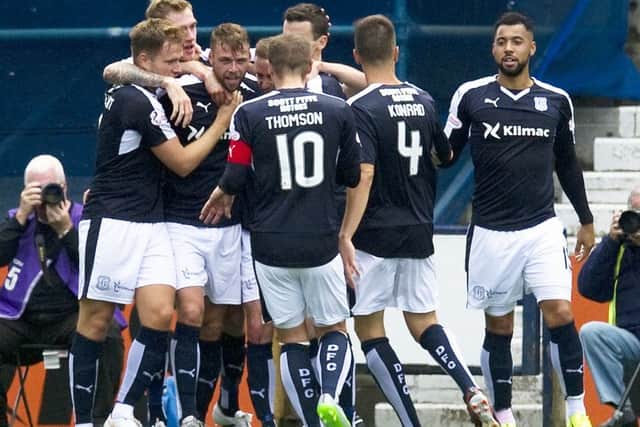 Dundee's Rory Loy, third from left, celebrates his goal with his team-mates. Picture: SNS