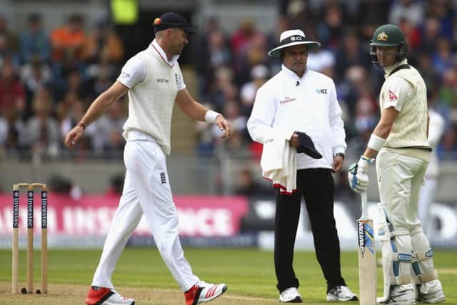 Michael Clarke of Australia exchanges words with England's James Anderson as Umpire Aleem Dar looks on. Picture: Getty Images