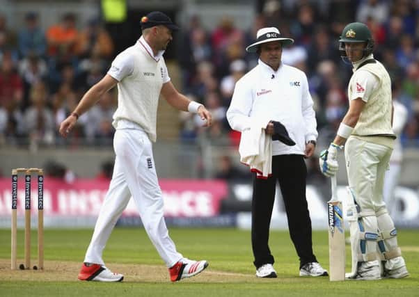 Michael Clarke of Australia exchanges words with England's James Anderson as Umpire Aleem Dar looks on. Picture: Getty Images