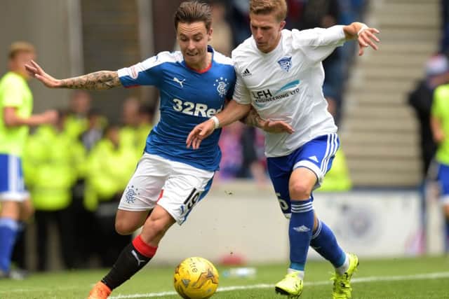 Barrie McKay, left, battles with Peterhead's Kevin Dzierzawski. Picture: SNS