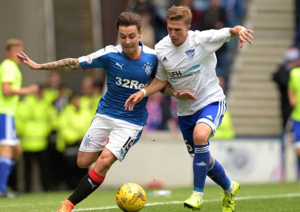 Barrie McKay, left, battles with Peterhead's Kevin Dzierzawski. Picture: SNS