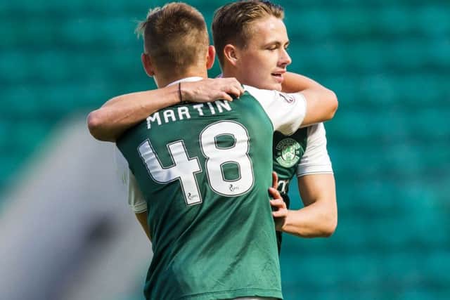 Scott Allan celebrates with team-mate Scott Martin after his goal, having come on as a substitute, had doubled Hibs lead over Montrose. Picture: SNS