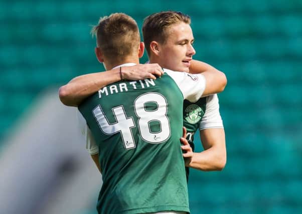Scott Allan celebrates with team-mate Scott Martin after his goal, having come on as a substitute, had doubled Hibs lead over Montrose. Picture: SNS