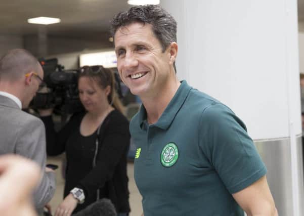 Celtic assistant manager John Collins at Glasgow Airport as his side leave for Azerbaijan. Picture: SNS