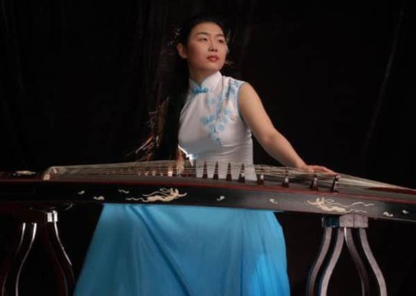 Classical zheng player Dong Yi
