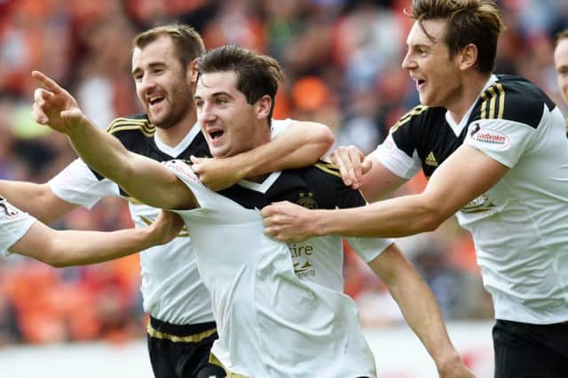 Kenny McLean celebrates his winner against Dundee United, one of three goals he has scored for Aberdeen away from home this season. Picture: SNS