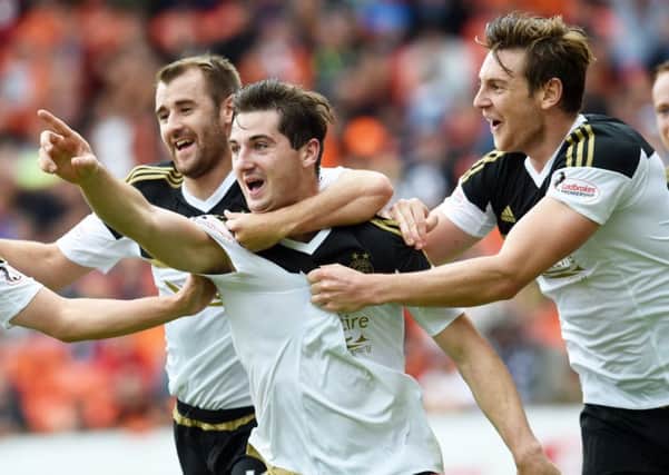 Kenny McLean celebrates his winner against Dundee United, one of three goals he has scored for Aberdeen away from home this season. Picture: SNS