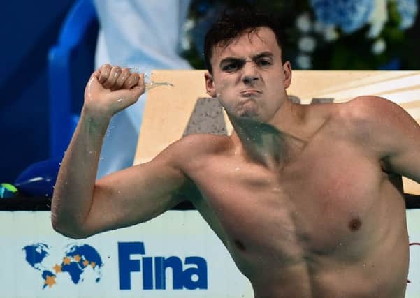Britain's James Guy celebrates after winning the final of the men's 200m freestyle swimming event in Kazan on August 4, 2015. Picture: AFP/Getty Images