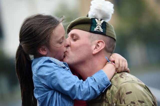 Lance Corporal Thomas Knox  with daughter Leah. Picture: PA