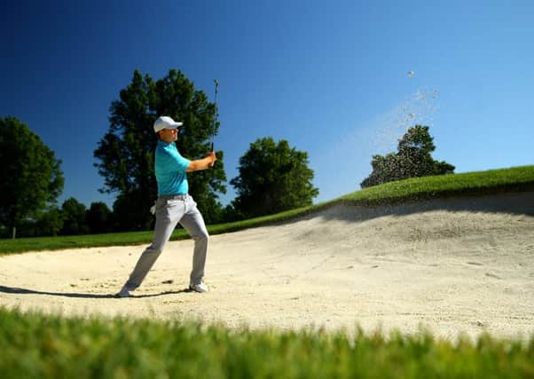Jordan Spieth plays from a bunker during a practice round for the WGC-Bridgestone Invitational at Firestone Coutry Club. Picture: Getty