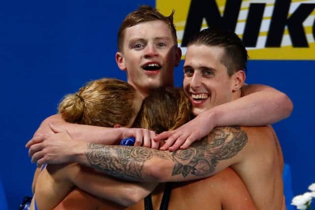British quartet Adam Peaty, Chris Walker-Hebborn, Siobhan-Marie OConnor and Fran Halsall celebrate winning gold in a world record of 3:41.71 in the mixed 4x100m medley relay final in Kazan. Picture: Getty