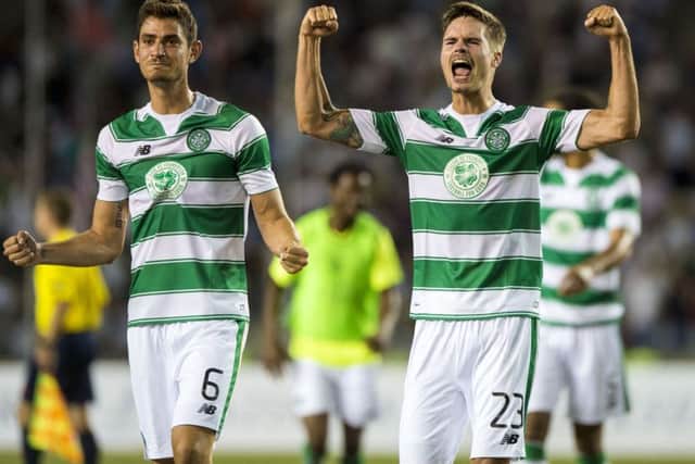 Celtic midfielder Nir Bitton, left, and defender Mikael Lustig celebrate at full-time after helping their side to a 0-0 draw against Qarabag in Baku. Picture: SNS