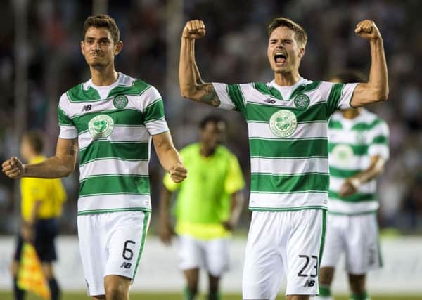 Celtic midfielder Nir Bitton, left, and defender Mikael Lustig celebrate at full-time after helping their side to a 0-0 draw against Qarabag in Baku. Picture: SNS