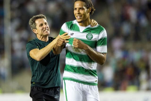 Virgil van Dijk is congratulated by John Collins after the final whistle. The Dutchman is as good as John Stones, according to BT Sport commentator Chris Sutton last night. Picture: SNS Group