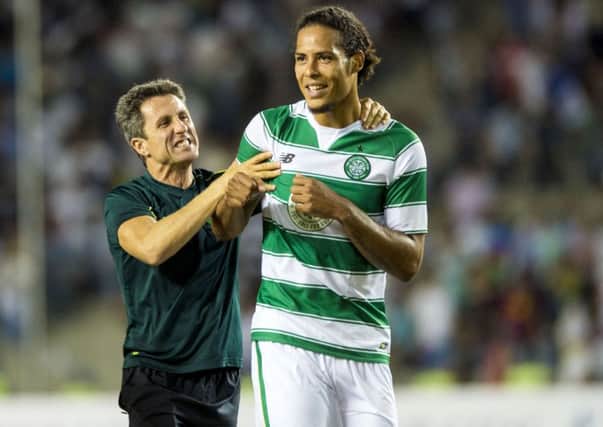 Virgil van Dijk is congratulated by John Collins after the final whistle. The Dutchman is as good as John Stones, according to BT Sport commentator Chris Sutton last night. Picture: SNS Group