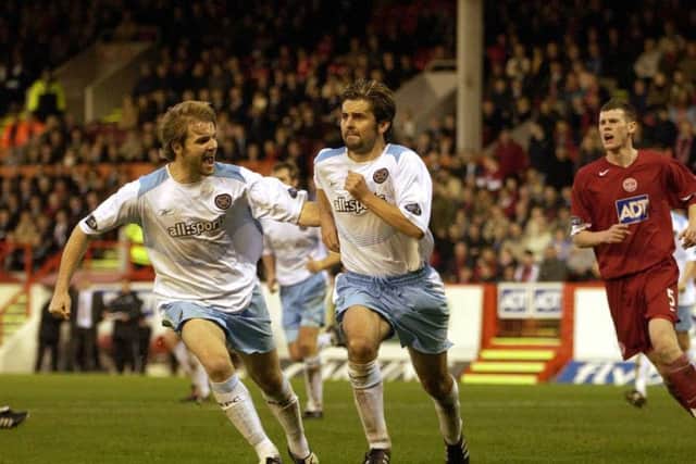 Paul Hartley celebrates scoring a penalty with Robbie Neilson back in 2004. Picture: Kate Chandler