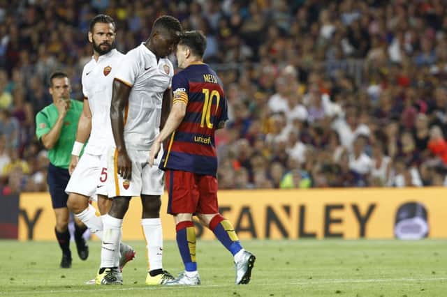 Messi (right) appeared to headbutt YangaMbiwa but only received a yellow card as the La Liga champions won the friendly 30. Picture: AFP/Getty