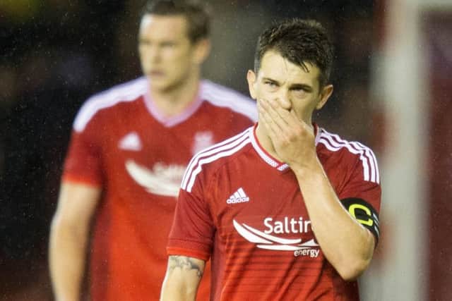 Aberdeen's Ryan Jack looks dejected at end of the Europa League Third Qualifying Round Second Leg match at Pittodrie. Picture: PA
