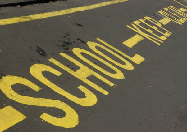 Parents are angry over plans to reduce access to free school transport to a number of secondary schools in South Lanarkshire. Picture: TSPL