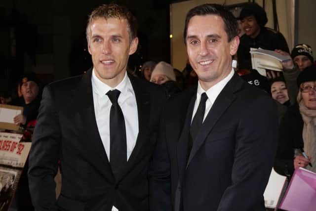 Phil Neville (left) and brother Gary. Picture: PA