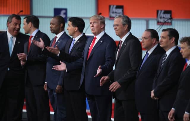 Donald Trump, centre, was the focus of attention right from the start of the first Republican debate. Picture: Getty