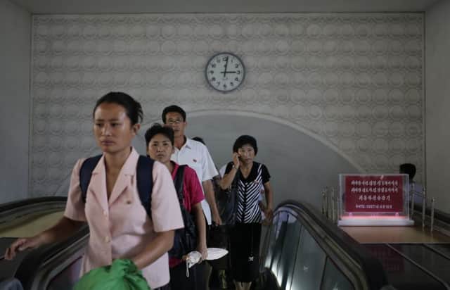 The clock in an Pyongyang tube station will change next week. Picture: AP