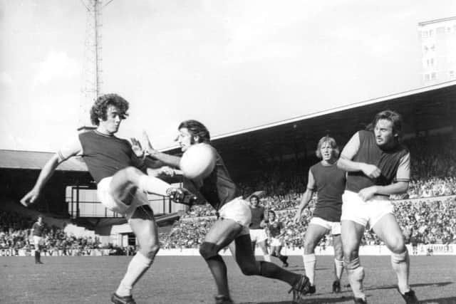 Ted McDougall playing for West Ham, left, vying with Frank Worthington of Leicester City. Picture: Getty