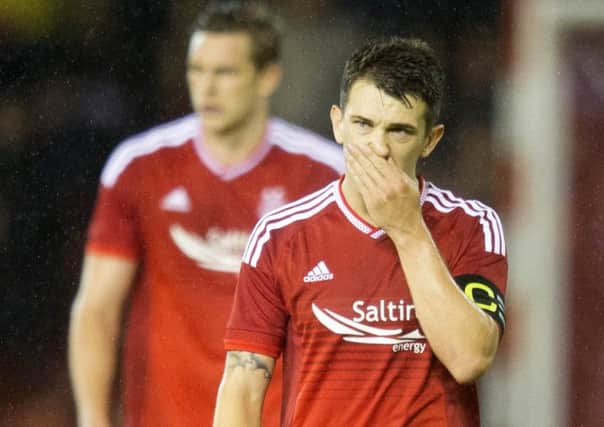 Aberdeen captain Ryan Jack trudges off the field after the aggregate defeat by Kairat Almaty ended his teams European hopes. Picture: PA
