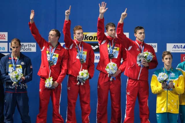 Robbie Renwick, Dan Wallace, Calum Jarvis and James Guy on the podium following their 4x200m relay victory. Picture: Getty